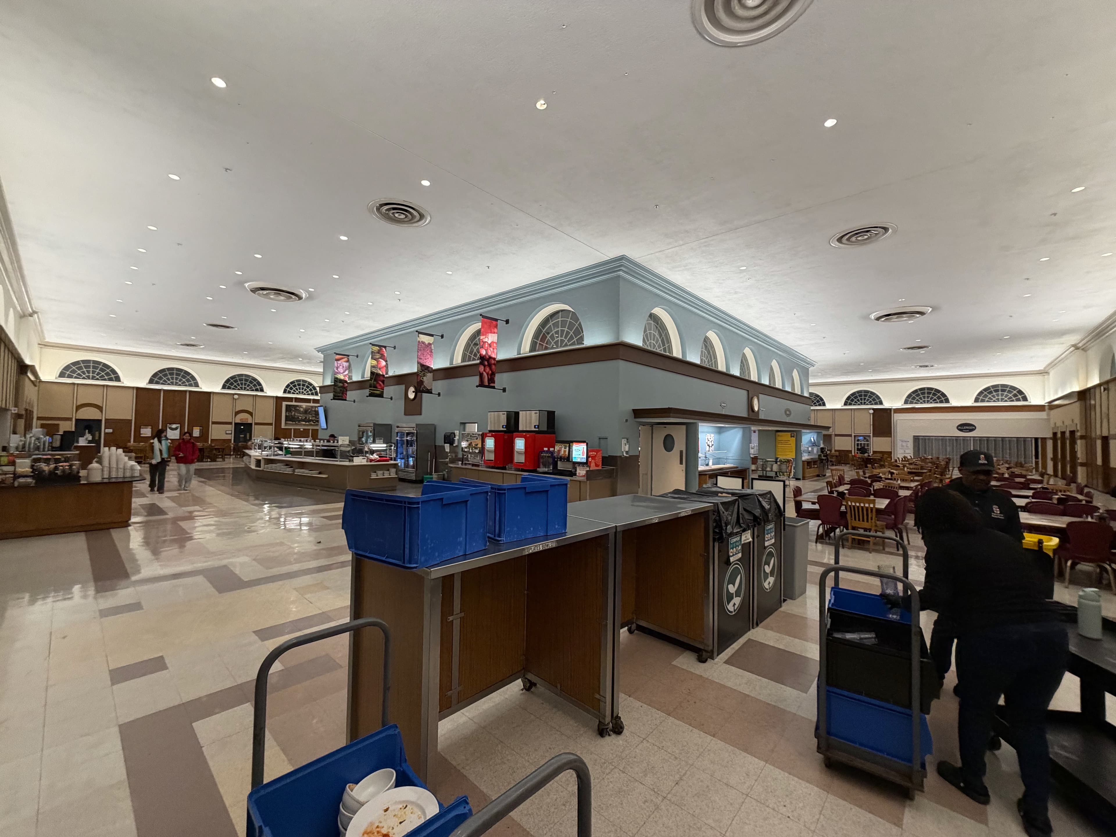 Wide-angle photo of the Ratty from the dish bussing station, with only Sulan, Irene, and a few Dining staff members left.